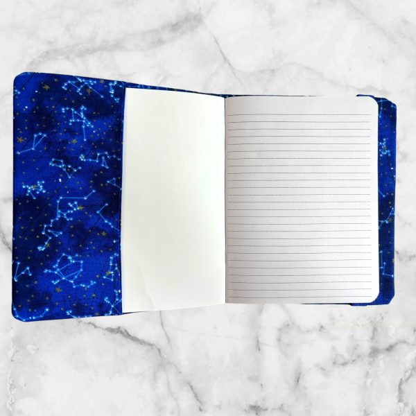 Mythical Blue Dragon notebook cover featuring a blue dragon against a cosmic night sky with a blue elastic band for closure.