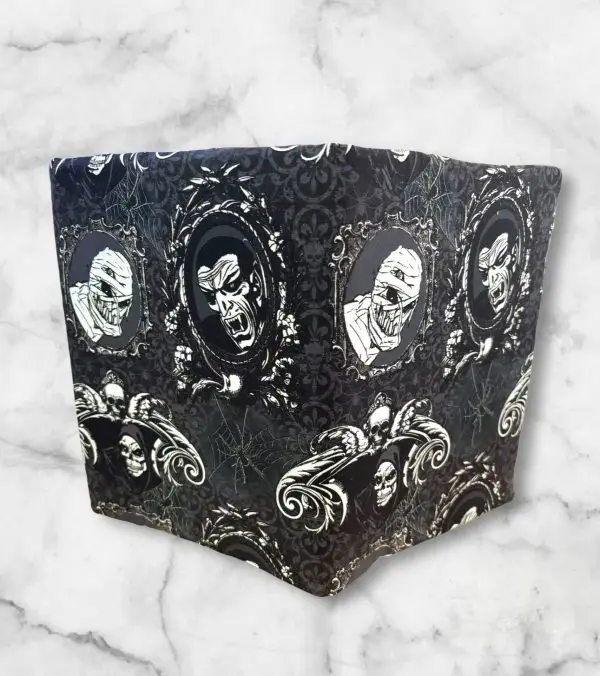 Scary Wicked Portraits notebook cover featuring classic monsters in gothic frames with a webbed background and an elastic band.