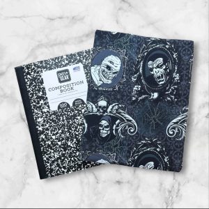 Scary Wicked Portraits notebook cover featuring classic monsters in gothic frames with a webbed background and an elastic band.