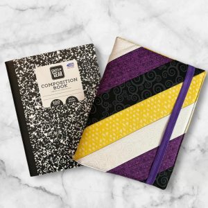 Purple and Yellow Diagonal composition notebook cover featuring bold stripes with a purple elastic band.