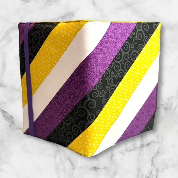 Purple and Yellow Diagonal composition notebook cover featuring bold stripes with a purple elastic band.