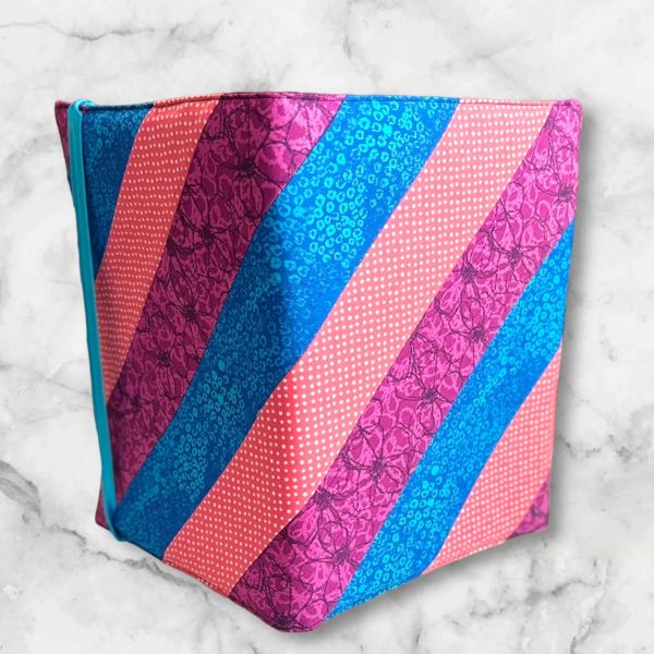 Pink, Purple and Blue Diagonal composition notebook cover with vibrant stripes and a blue elastic band.