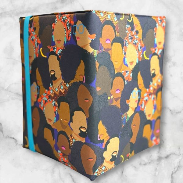 African American Print composition notebook cover featuring powerful Black faces design with a blue elastic band.