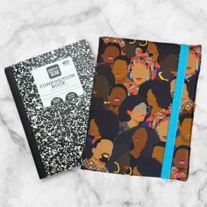 African American Print composition notebook cover featuring powerful Black faces design with a blue elastic band.