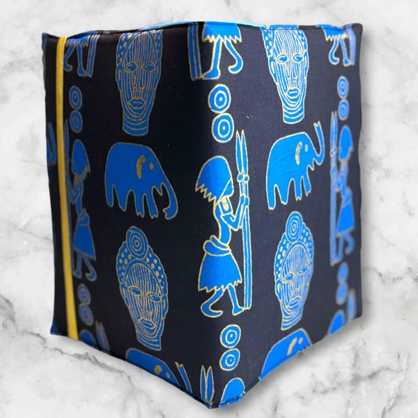 Blue African Symbols composition notebook cover featuring blue symbols with gold accents on a navy blue background with a gold elastic band.