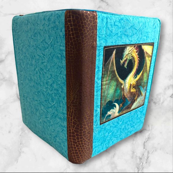 Dragon Fyre composition notebook cover with a majestic dragon on a turquoise background, featuring a brown textured spine.