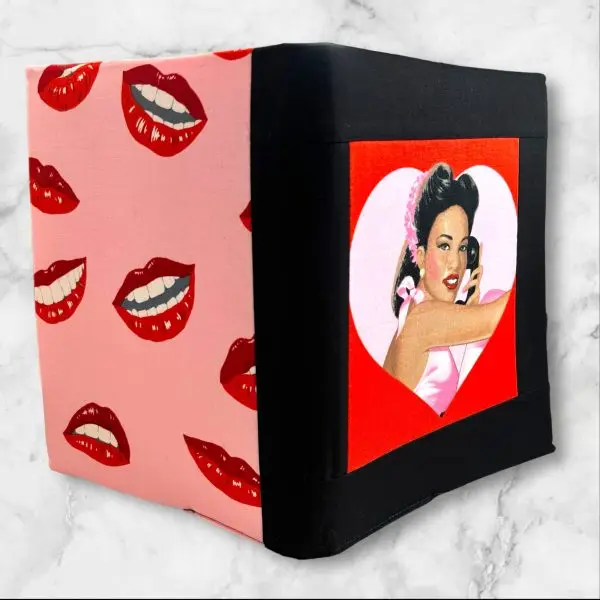 Glamorous Retro Pin-Up Girl Composition Notebook Cover with a smiling pin-up girl in a pink satin top framed by a heart-shaped red background.