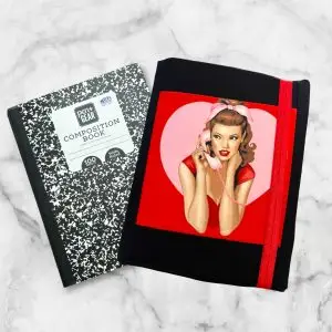 Classic Pin-Up Girl Composition Notebook Cover featuring a retro design with a stylish pin-up girl framed in a heart-shaped red background.