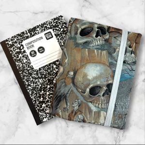 A composition notebook cover with a haunting design of skulls and bones in a dark, muted color palette. The cover features a gray elastic band and is displayed alongside a standard composition notebook.