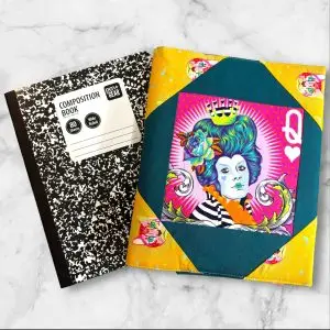 Quilted composition notebook cover with a vibrant, colorful design featuring a Queen of Hearts-inspired illustration in bold, artistic patterns.