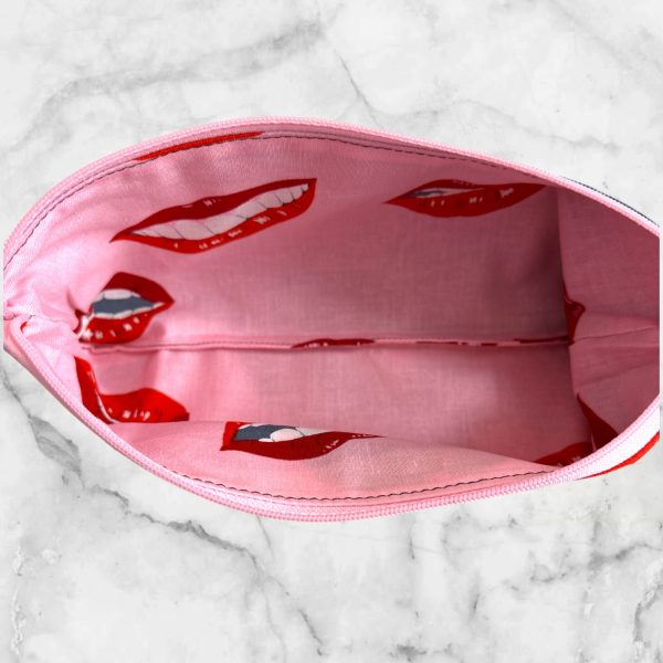 Stylish Retro Pin-Up Girl - Dial LOVE Zipper Pouch featuring a girl with a pink ribbon, pink zipper, and lined with Girl Talk fabric.